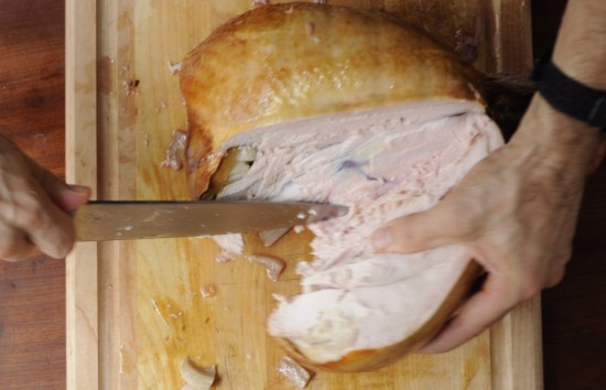 Remove the whole breast from the turkey, running your knife as close to the carcass as possible.